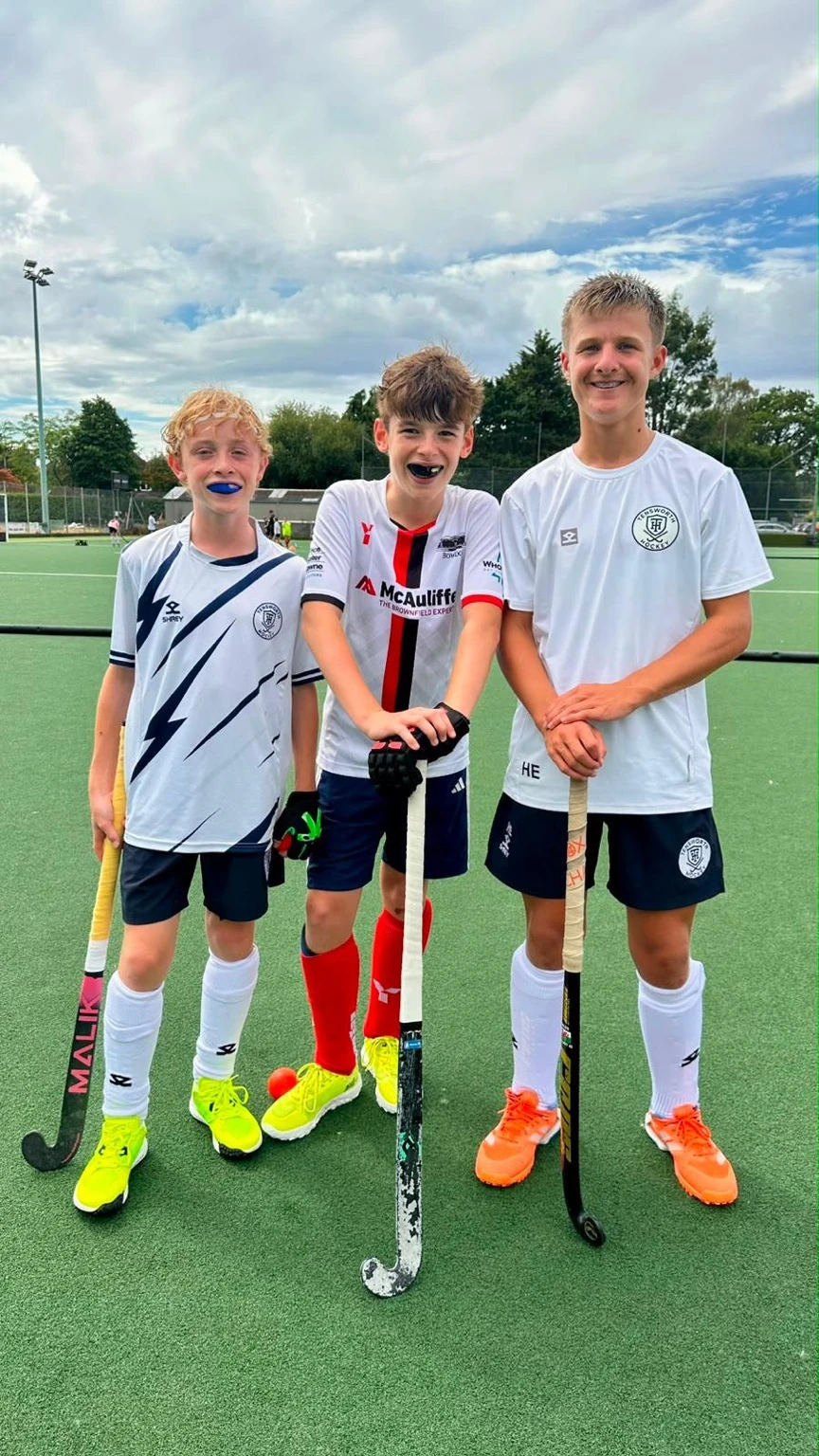 Three young hockey players after a UK Sports Hockey Coaching session