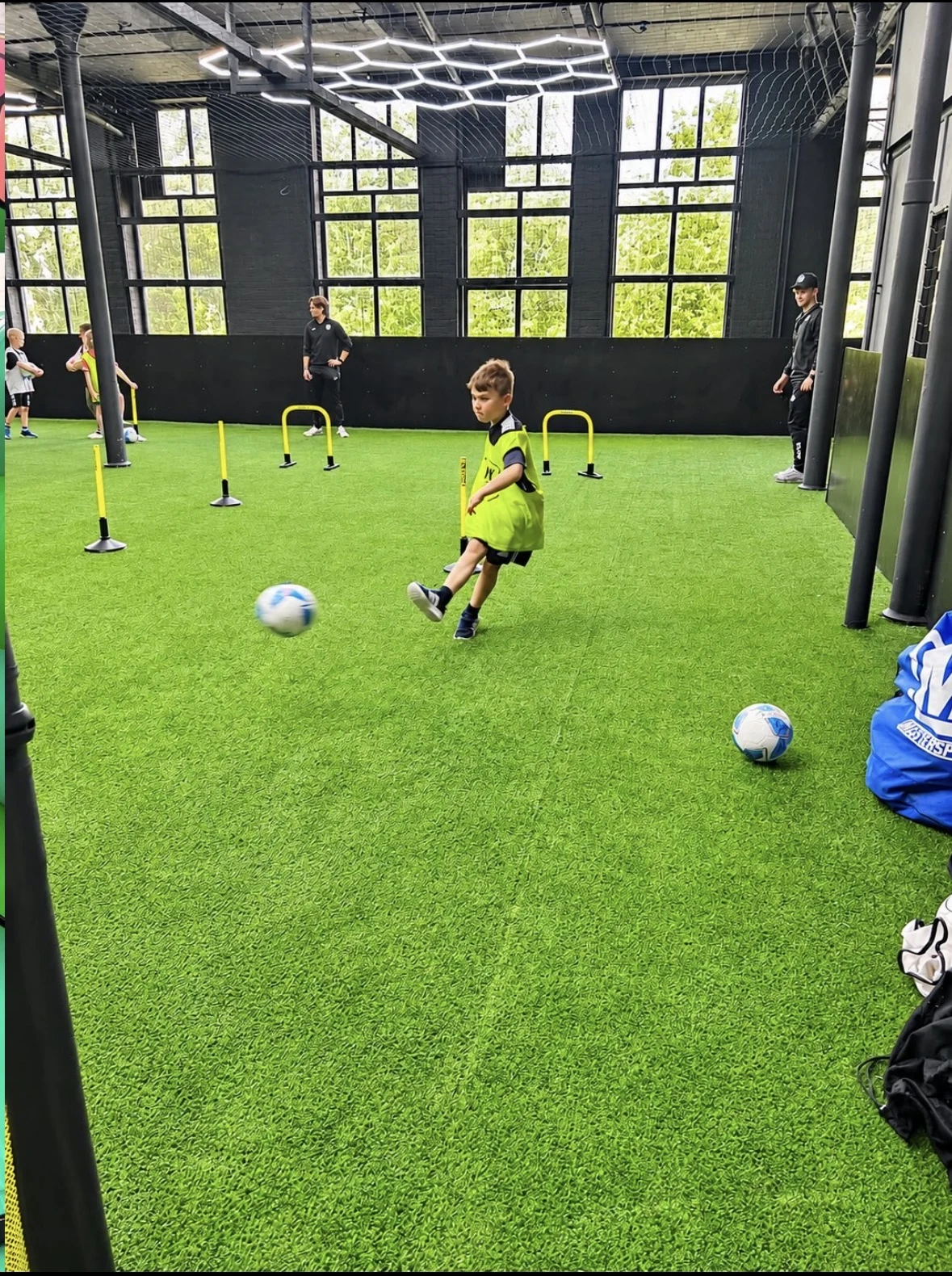 Children enjoying a UK Sports birthday party session in the arena